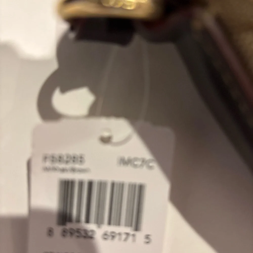 Coach Signature File Bag - Style F58285
Classic Khaki canvas with leather trim - Picture 3 of 6